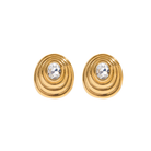 Gold earrings with circular ribbed oval designs and crystal gemstones. vintage inspired jewelry, earrings.